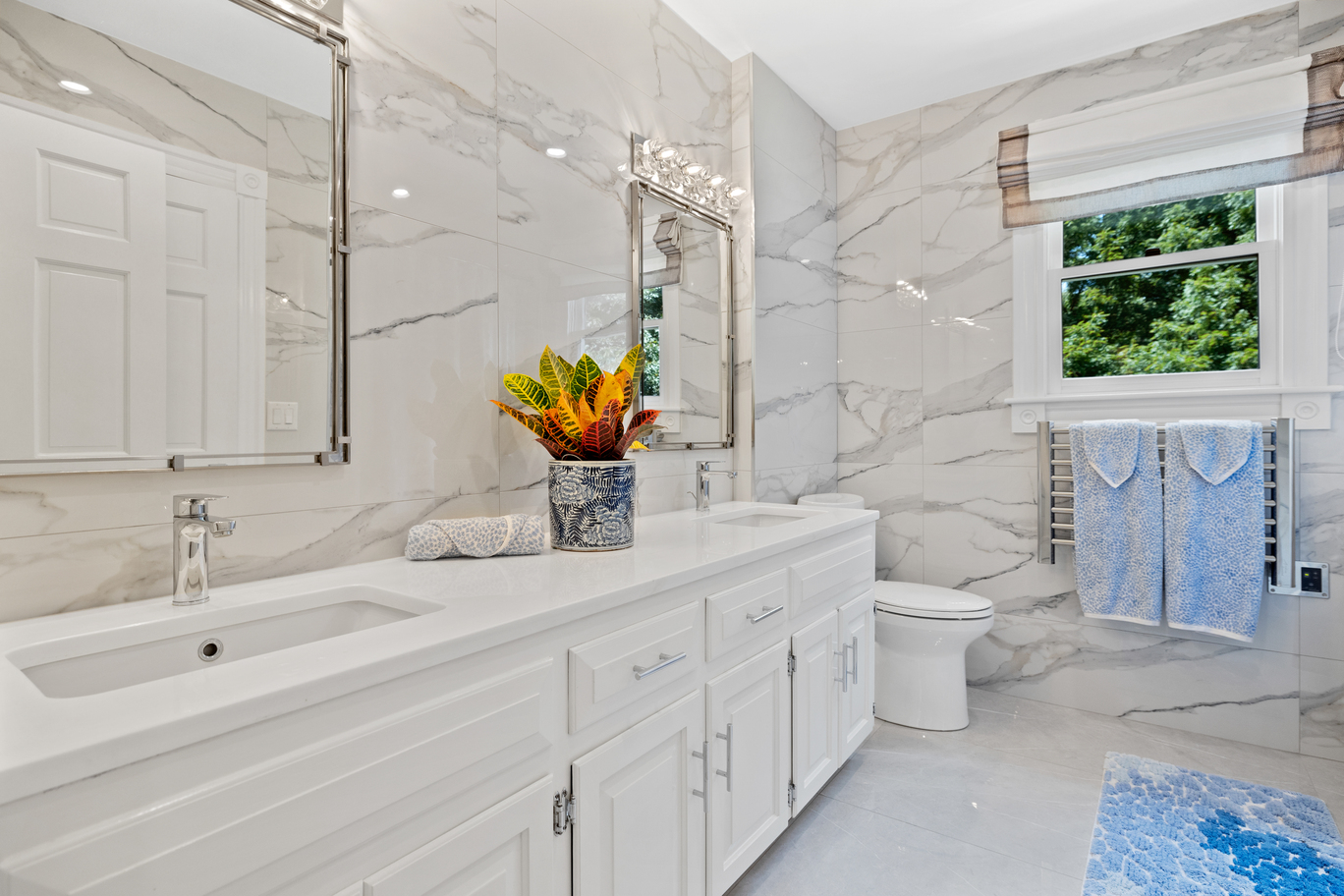 Elegant bathroom vanity with double sinks and large mirror